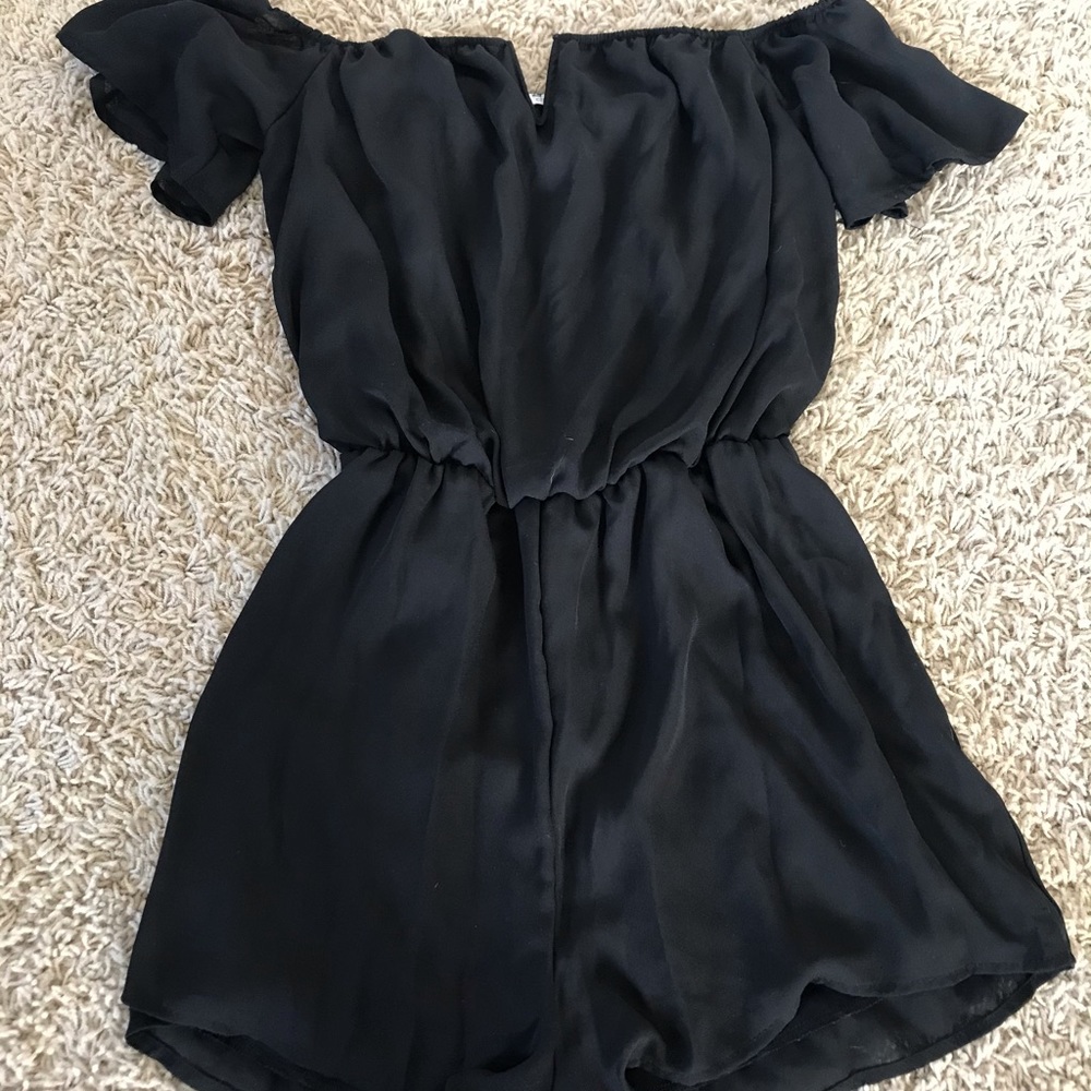 Black off the shoulder romper with v cutout detail